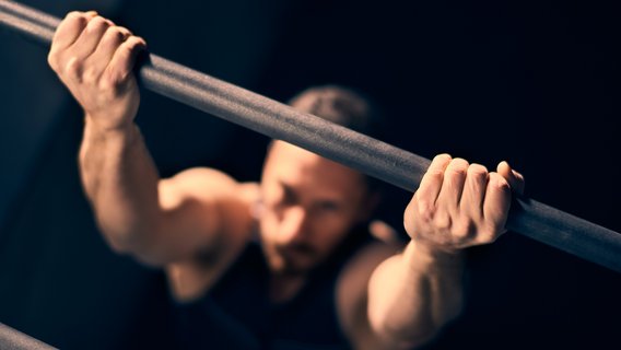 One person does pull-ups
