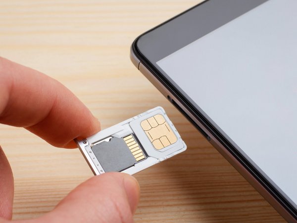Close-up of SIM card and memory card for a smartphone.