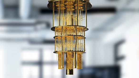 Komponente eines Quantencomputers in Gold. | TÜVIT